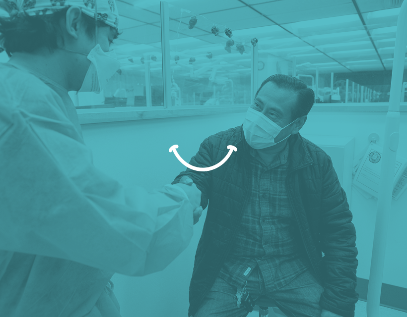 A smile icon over a photo of a dental patient