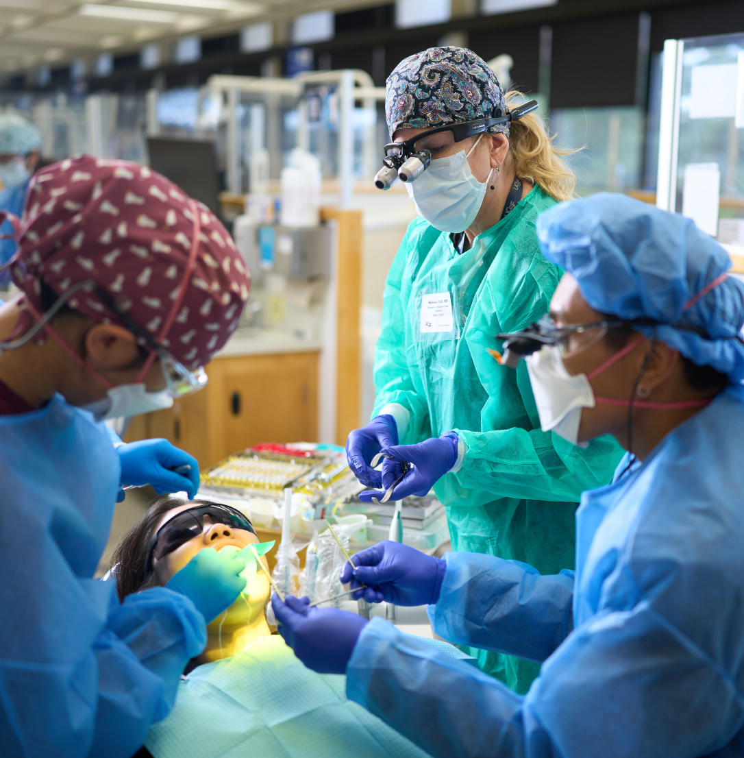 DDS student and faculty provide care to a patient