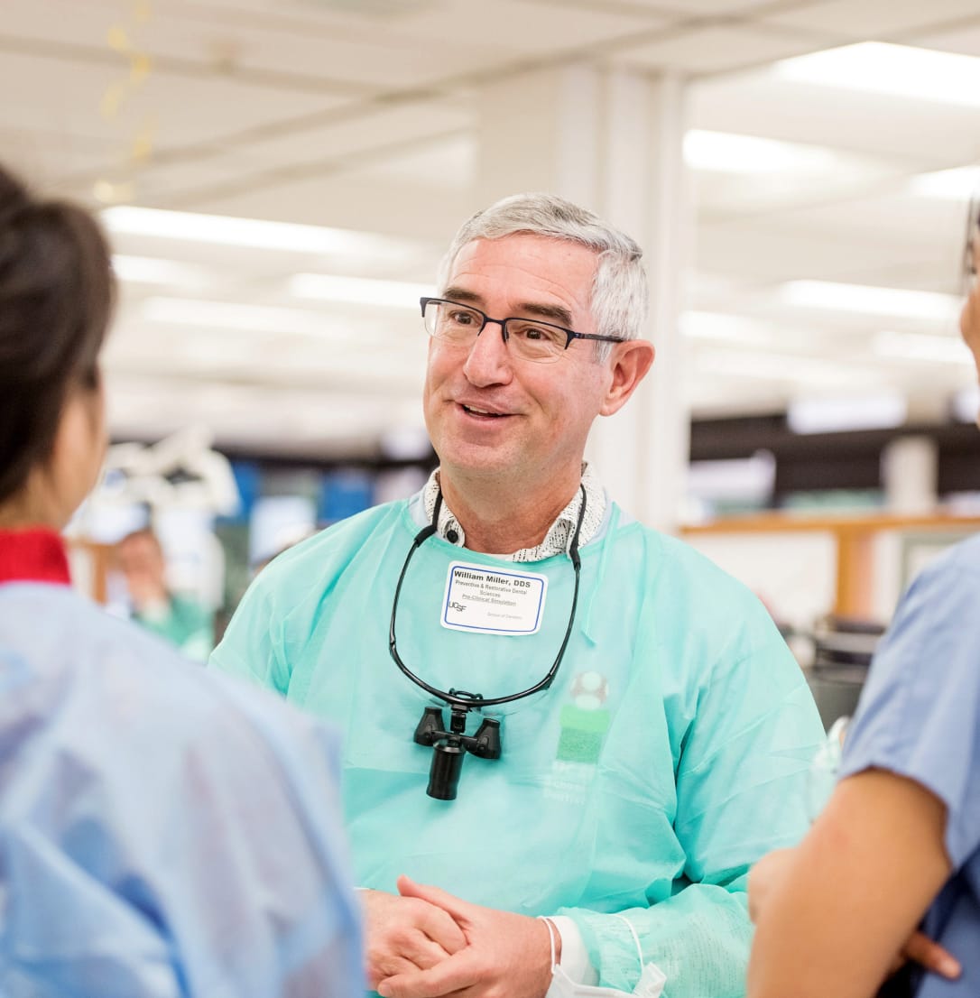 A senior doctor wearing a protective gear